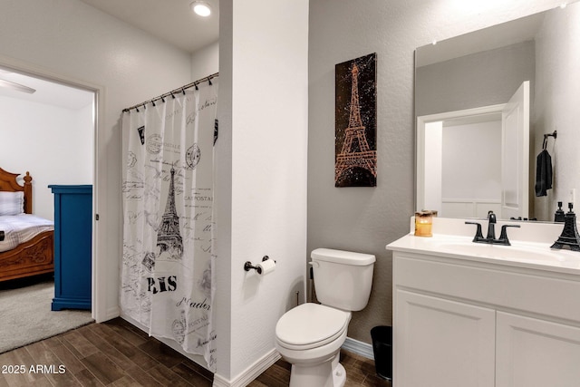 4595 W Foldwing Dr, San Tan Valley, AZ 85144 - ensuite bathroom with wood finished floors, vanity, toilet, and curtained shower