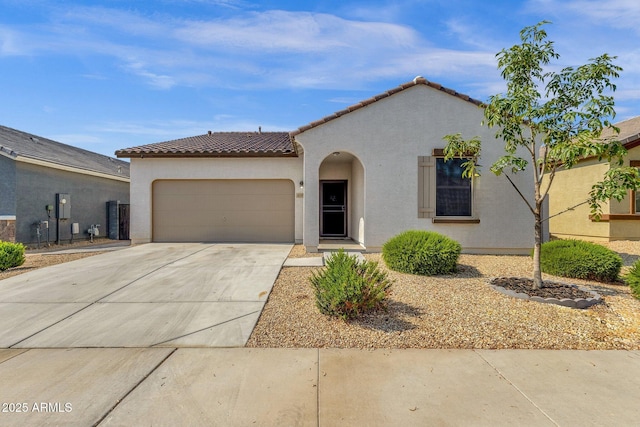 4595 W Foldwing Dr, San Tan Valley, AZ 85144 - mediterranean / spanish-style home with an attached garage, stucco siding, a tile roof, and driveway