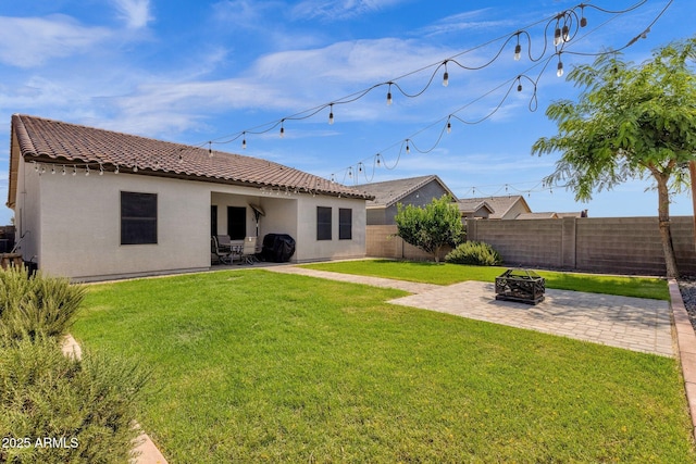 4595 W Foldwing Dr, San Tan Valley, AZ 85144 - back of house with a patio area, a tiled roof, an outdoor fire pit, and stucco siding