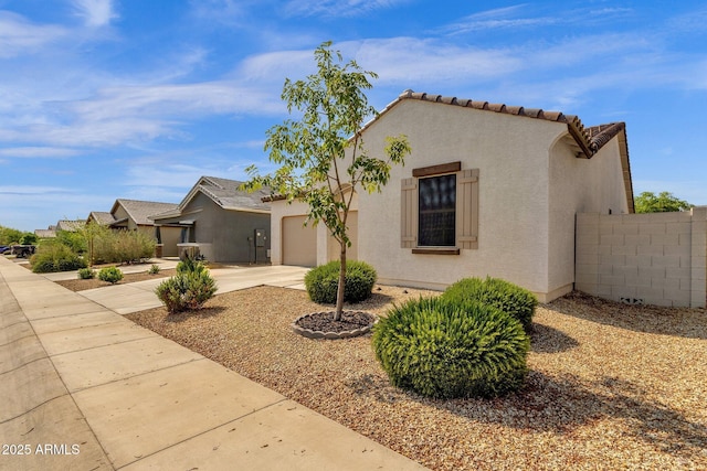 4595 W Foldwing Dr, San Tan Valley, AZ 85144 - mediterranean / spanish home featuring driveway, a garage, stucco siding, and a tile roof
