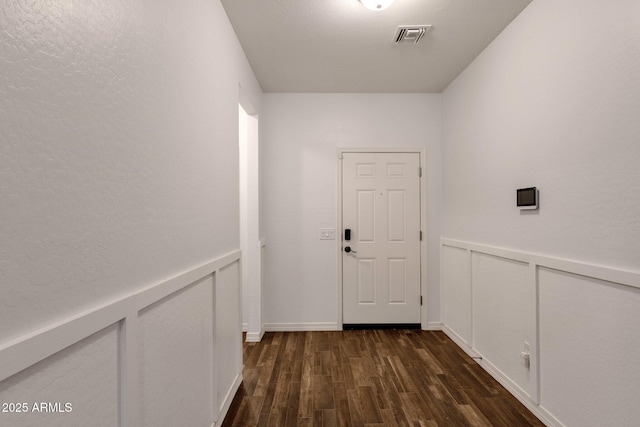 4595 W Foldwing Dr, San Tan Valley, AZ 85144 - doorway to outside featuring dark wood-type flooring and wainscoting