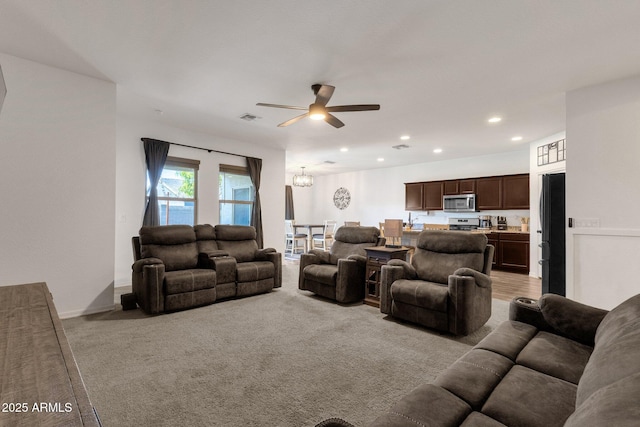 4595 W Foldwing Dr, San Tan Valley, AZ 85144 - living area featuring light carpet, ceiling fan, a chandelier, recessed lighting, and baseboards