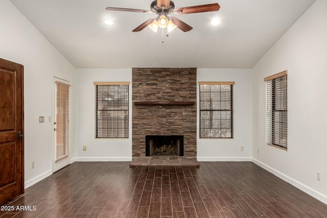 13128 N 104th Pl, Scottsdale, AZ 85260 - unfurnished living room featuring vaulted ceiling, a ceiling fan, a fireplace, baseboards, and wood finished floors