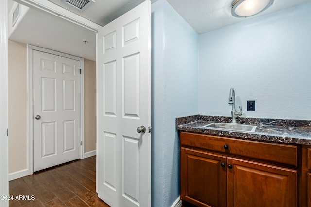 bathroom featuring wood-type flooring and vanity