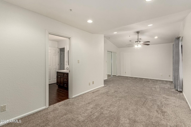 13128 N 104th Pl, Scottsdale, AZ 85260 - spare room featuring dark carpet, recessed lighting, a ceiling fan, baseboards, and lofted ceiling