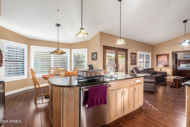 kitchen featuring lofted ceiling, dishwasher, a kitchen island with sink, and hanging light fixtures