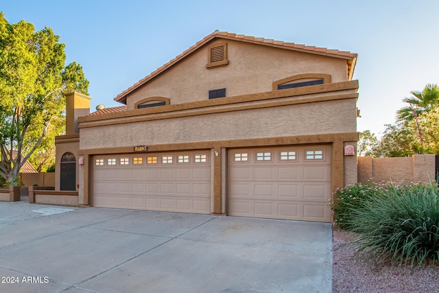 view of property featuring a garage