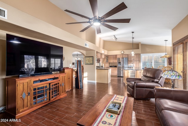 living room with lofted ceiling, sink, and ceiling fan