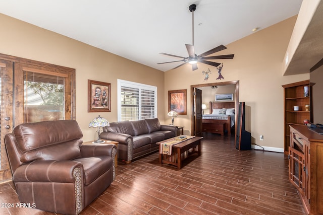 living room with dark wood-type flooring, ceiling fan, and a healthy amount of sunlight