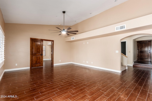 spare room with ceiling fan, lofted ceiling, and dark hardwood / wood-style flooring