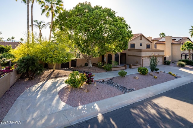 13128 N 104th Pl, Scottsdale, AZ 85260 - view of front of house with stucco siding, driveway, an attached garage, and a tile roof