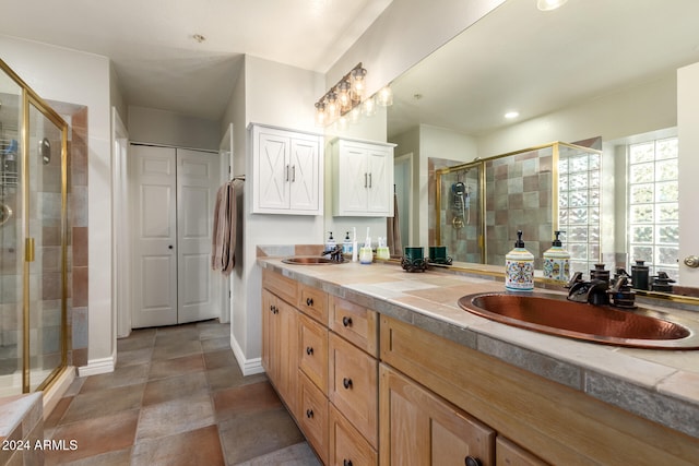 bathroom with vanity and an enclosed shower