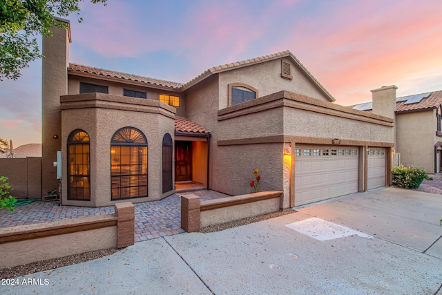 13128 N 104th Pl, Scottsdale, AZ 85260 - view of front of property featuring concrete driveway, a garage, stucco siding, and a tiled roof
