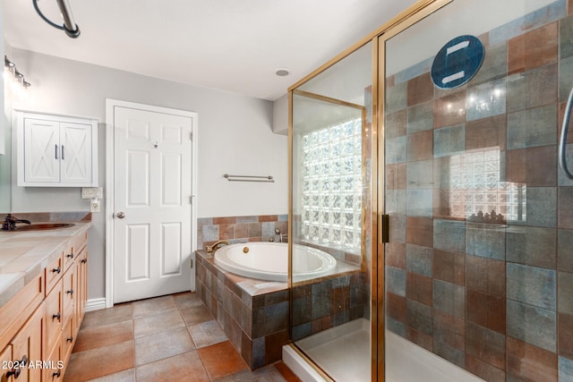 bathroom with vanity, tile patterned flooring, and separate shower and tub