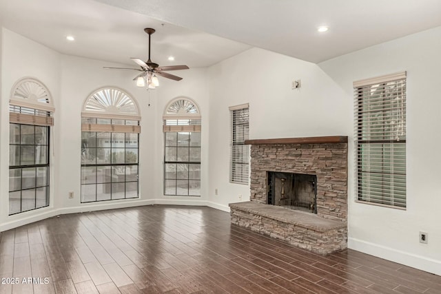 13128 N 104th Pl, Scottsdale, AZ 85260 - unfurnished living room featuring ceiling fan, dark wood finished floors, a fireplace, baseboards, and recessed lighting