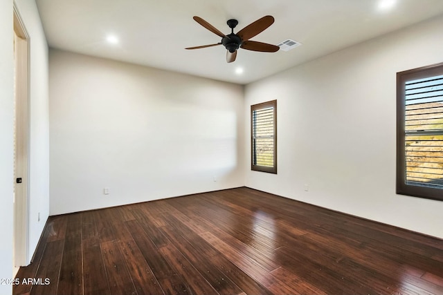 spare room with wood-type flooring, visible vents, ceiling fan, and recessed lighting