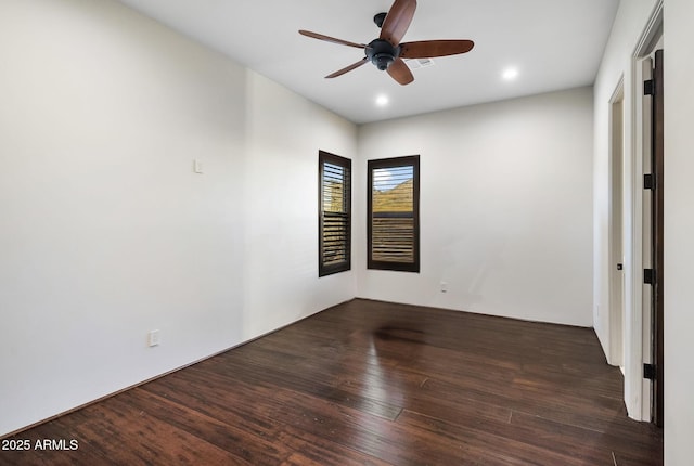 spare room with wood finished floors, a ceiling fan, and recessed lighting