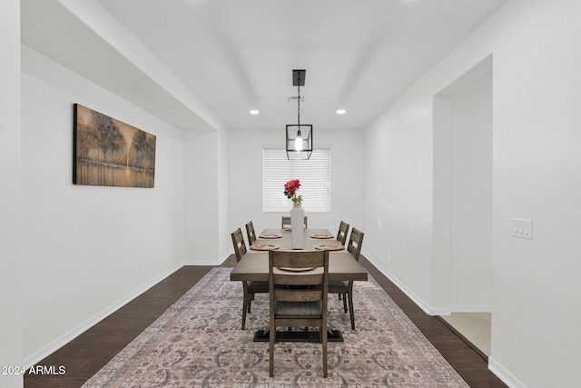 dining room with dark hardwood / wood-style flooring