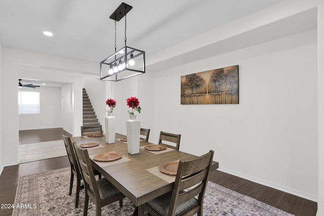 dining space featuring ceiling fan and dark hardwood / wood-style floors