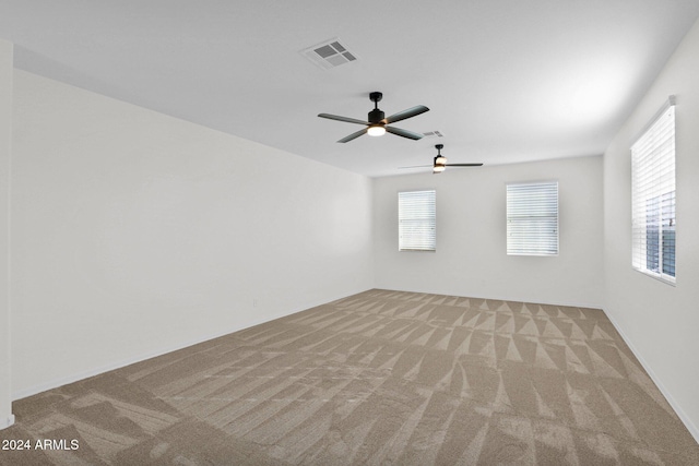 carpeted empty room with ceiling fan