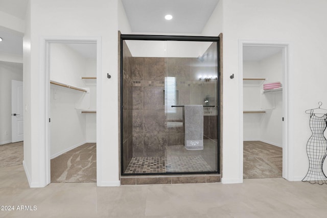 bathroom with a shower with shower door