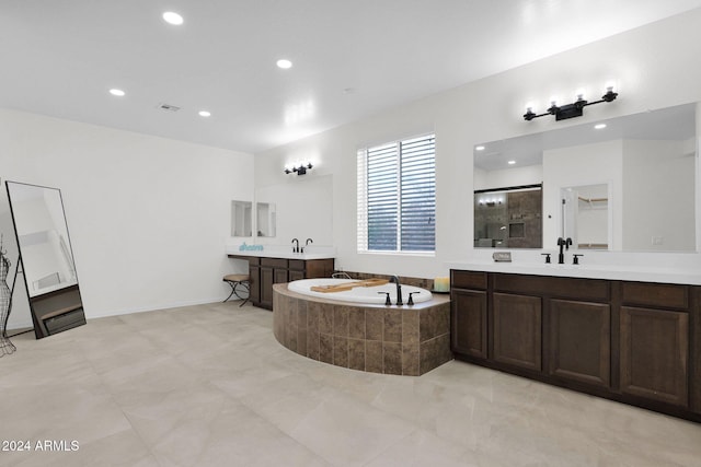 bathroom with plus walk in shower and vanity