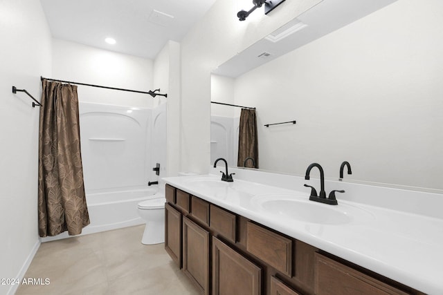 full bathroom featuring shower / bath combination with curtain, vanity, and toilet