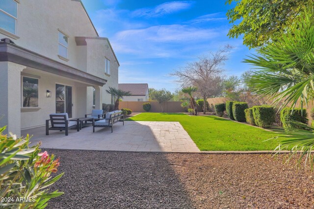 view of yard with outdoor lounge area and a patio