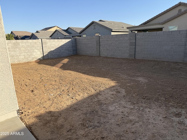 view of yard with a fenced backyard