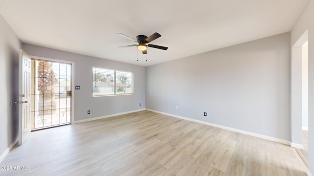 unfurnished room featuring ceiling fan and light wood-type flooring