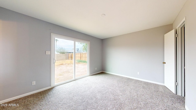 unfurnished room with carpet flooring