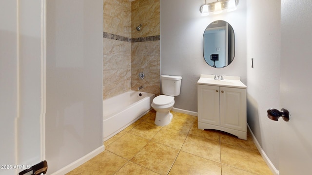 full bathroom with tile patterned flooring, vanity, tiled shower / bath combo, and toilet