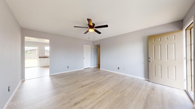 spare room with ceiling fan and light hardwood / wood-style floors