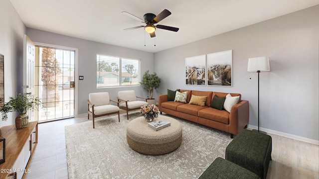 living room with ceiling fan and light hardwood / wood-style flooring