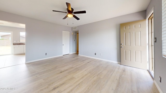 interior space with ceiling fan and light hardwood / wood-style floors