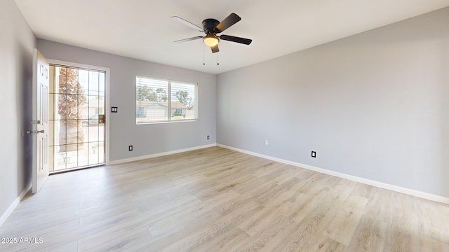 unfurnished room with ceiling fan and light wood-type flooring