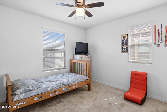 bedroom with carpet, baseboards, and ceiling fan