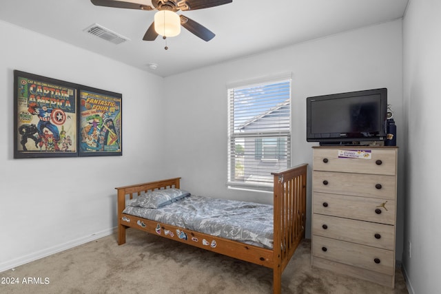 bedroom featuring baseboards, visible vents, ceiling fan, and carpet flooring