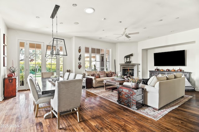 dining room featuring recessed lighting, a healthy amount of sunlight, and wood finished floors