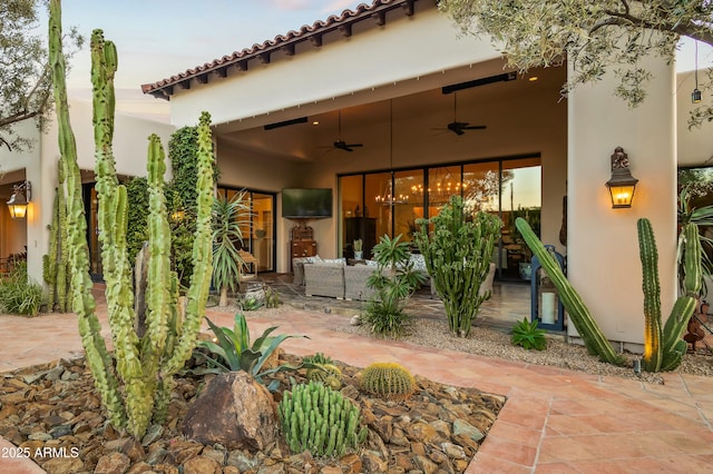 view of patio / terrace featuring a ceiling fan and an outdoor hangout area