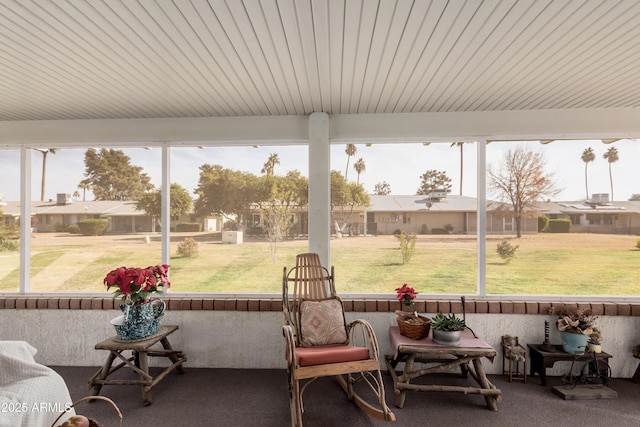 sunroom / solarium featuring a healthy amount of sunlight