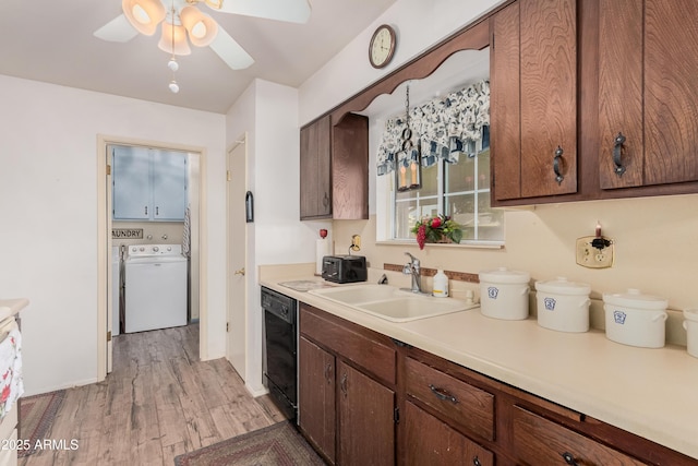 kitchen with ceiling fan, dishwasher, sink, light hardwood / wood-style flooring, and washer and clothes dryer