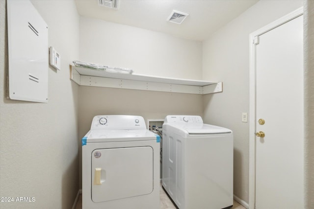 laundry area with independent washer and dryer