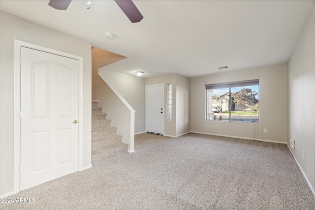 interior space featuring ceiling fan