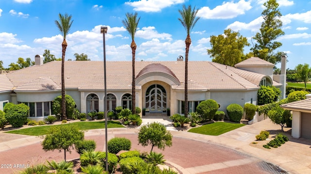 7475 E Gainey Ranch Rd Unit 22, Scottsdale, AZ 85258 - view of property featuring concrete driveway and a garage