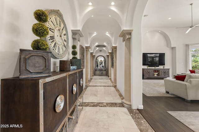 7475 E Gainey Ranch Rd Unit 22, Scottsdale, AZ 85258 - hall featuring decorative columns, recessed lighting, and inlaid floor details