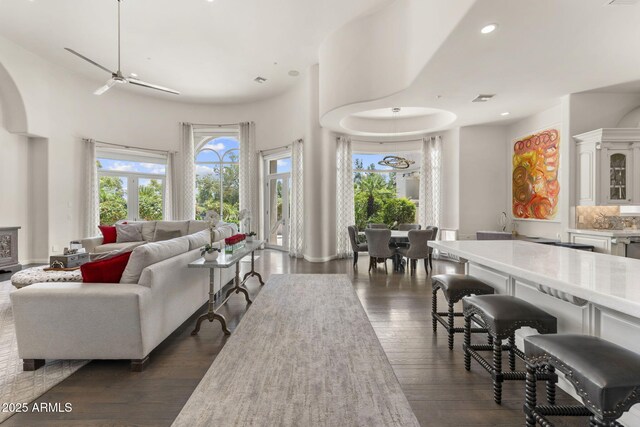 7475 E Gainey Ranch Rd Unit 22, Scottsdale, AZ 85258 - living room featuring dark wood-style floors, a ceiling fan, and recessed lighting