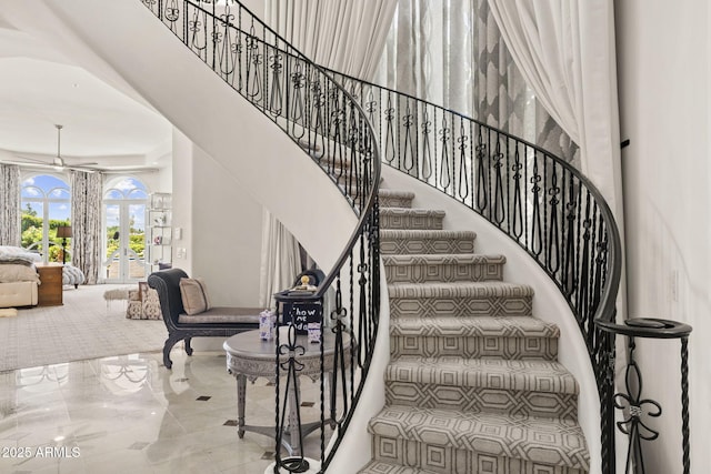 7475 E Gainey Ranch Rd Unit 22, Scottsdale, AZ 85258 - stairs featuring a ceiling fan and french doors