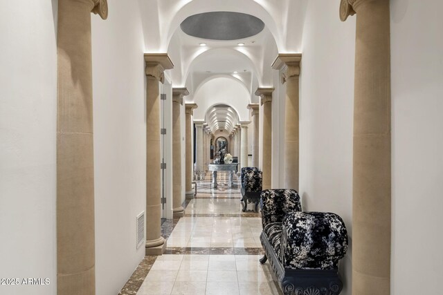 7475 E Gainey Ranch Rd Unit 22, Scottsdale, AZ 85258 - corridor with ornate columns, inlaid floor details, and marble tiled flooring