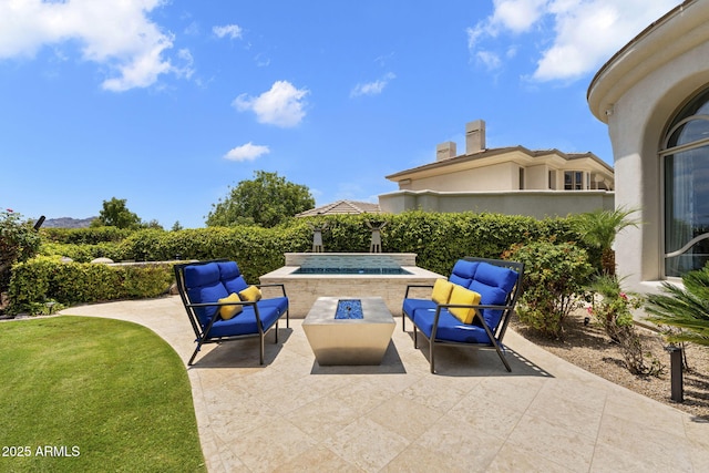 7475 E Gainey Ranch Rd Unit 22, Scottsdale, AZ 85258 - view of patio with an outdoor living space with a fire pit